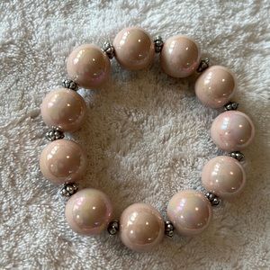 Garold Miller stretch bracelet with silver separators. Incandescent ivory/tan